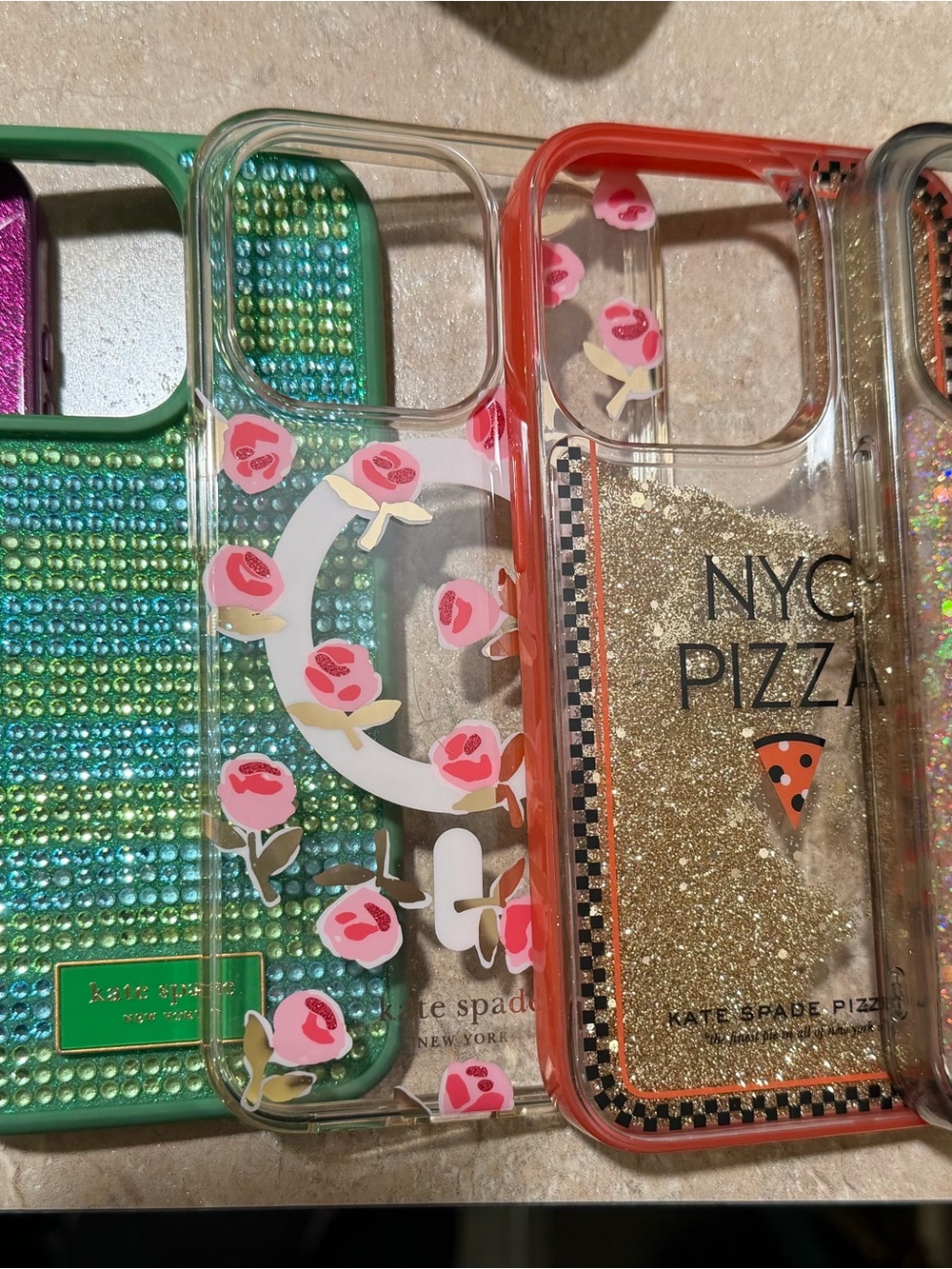 Kate Spade Clear iPhone 15 Pro Cases Variety of them. Pink, Green, & Flowers.
